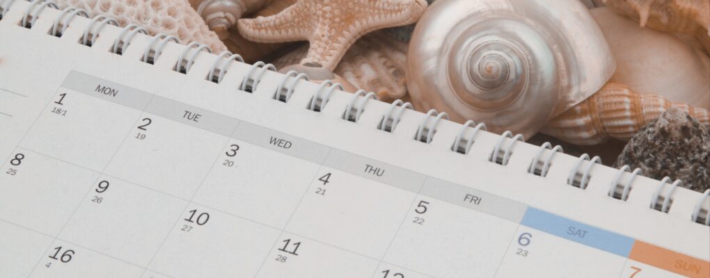 calendar next to some seashells